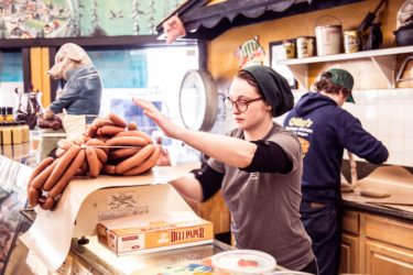 Otto&#039;s Sausage kitchen weighing sausages