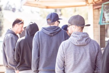 People standing in line outside Otto&#039;s Sausage Kitchen